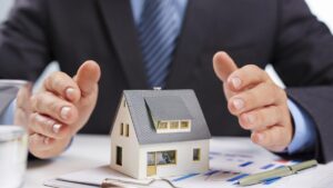 A professional property manager safeguarding a model house, overseeing property documents, and ensuring investment security.