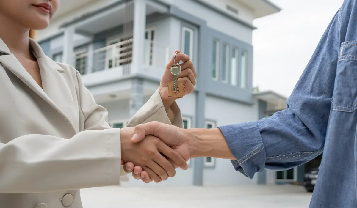 Tenant receives keys from a trusted property management company near you after successful leasing.