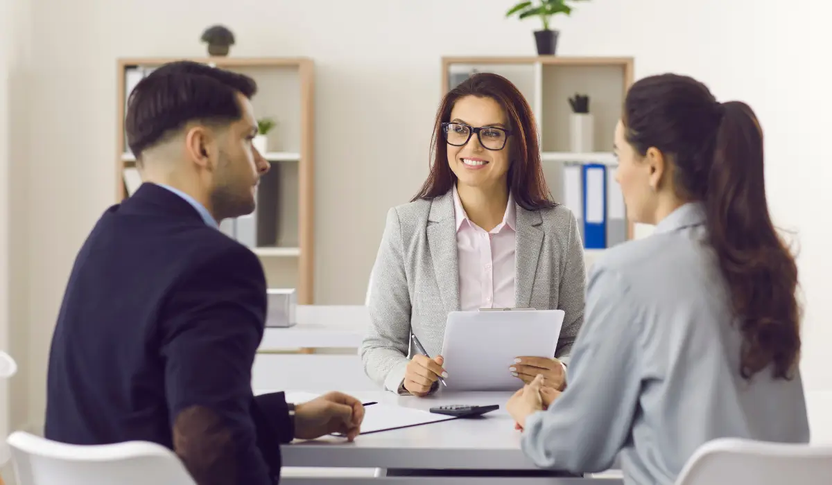 Full-service property management professional meeting with tenants to build trust and maintain structured communication systems